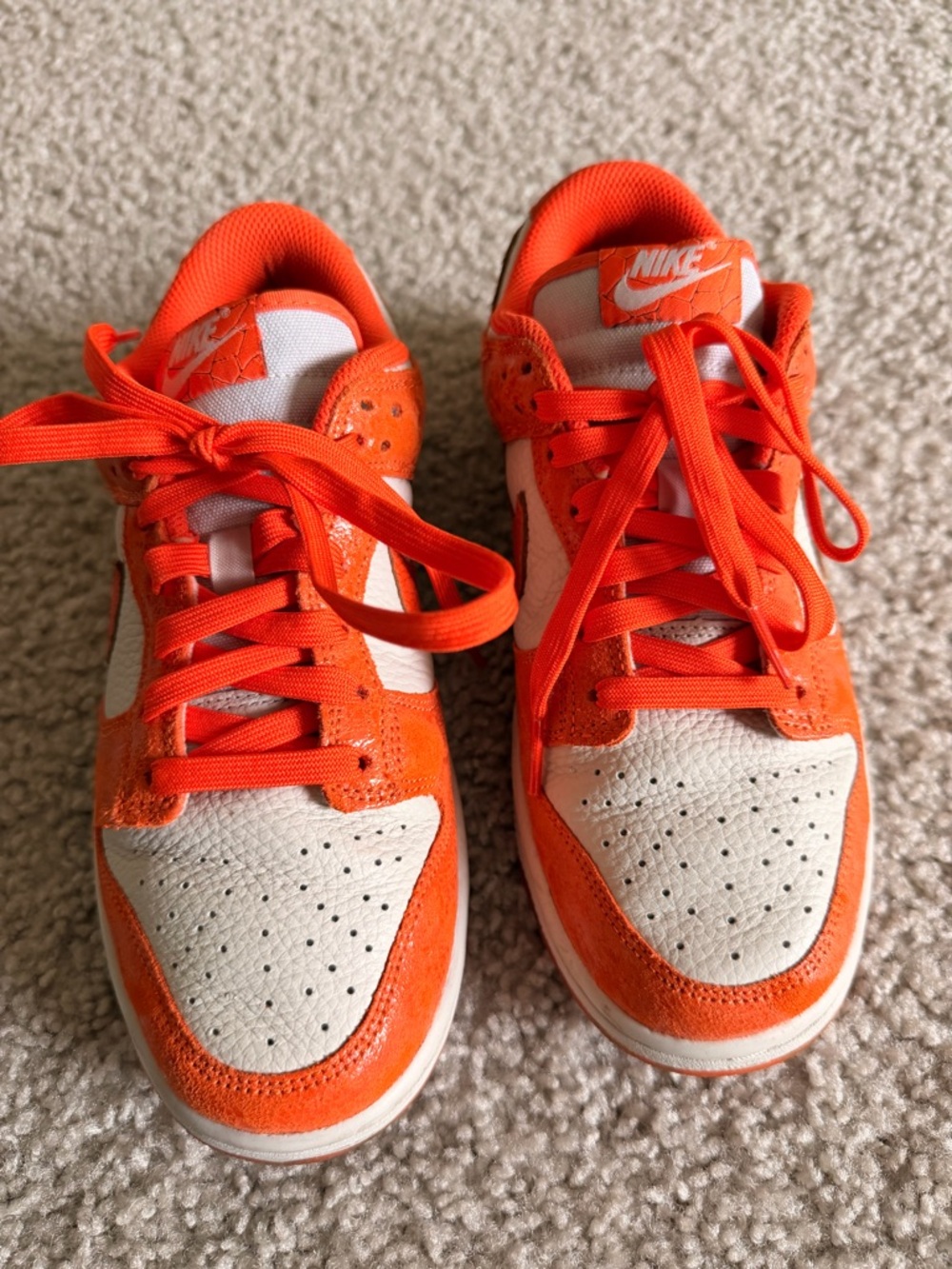 Nike Dunk Orange and White Low-Top Sneakers with Bold Swoosh